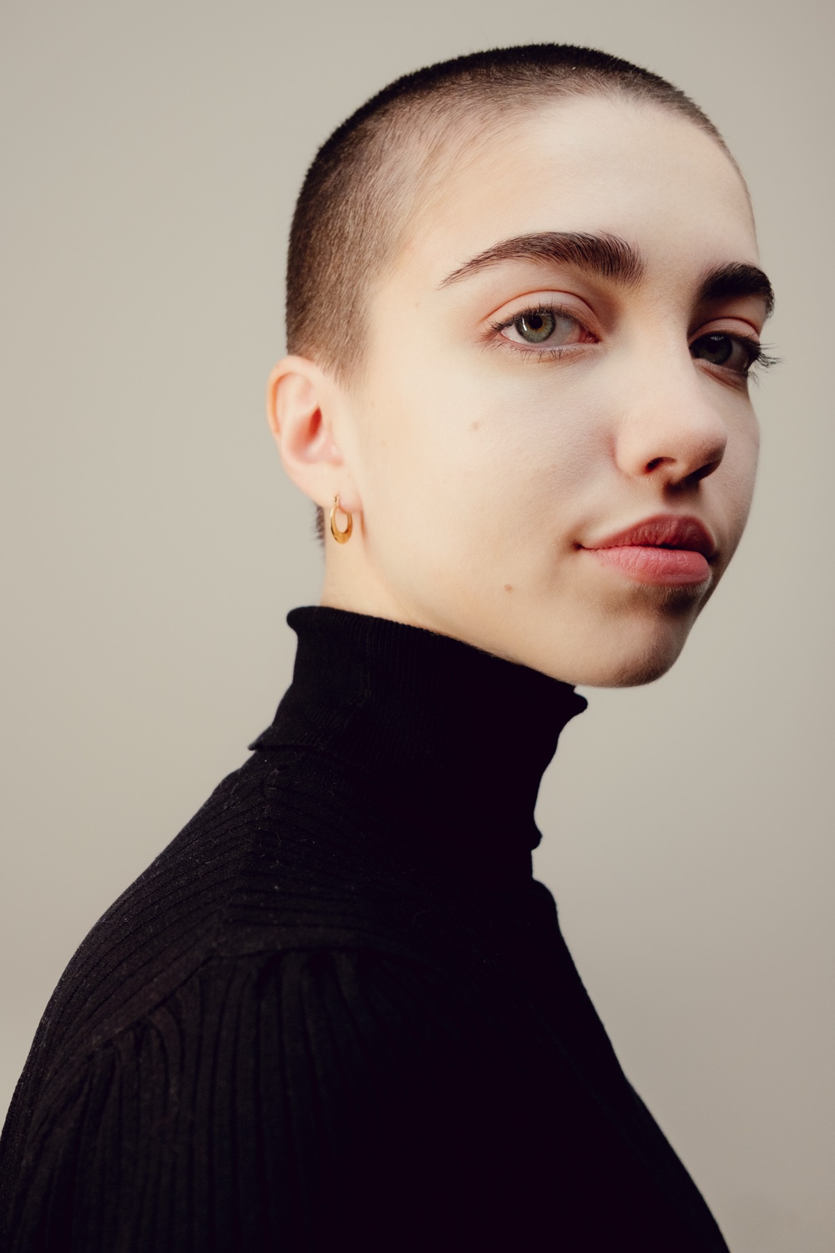 Warm-toned creative portrait of Victoria in three-quarter profile